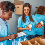 Two non-profit workers taking inventory of donations